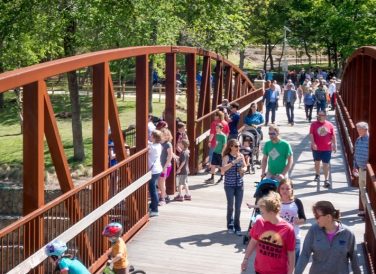 people on bridge at Historic Water Station Park in Allen, TX